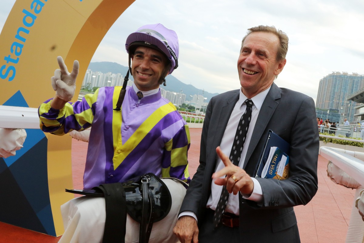 Trainer John Size celebrates his milestone with stable jockey Joao Moreira. Photos: Kenneth Chan