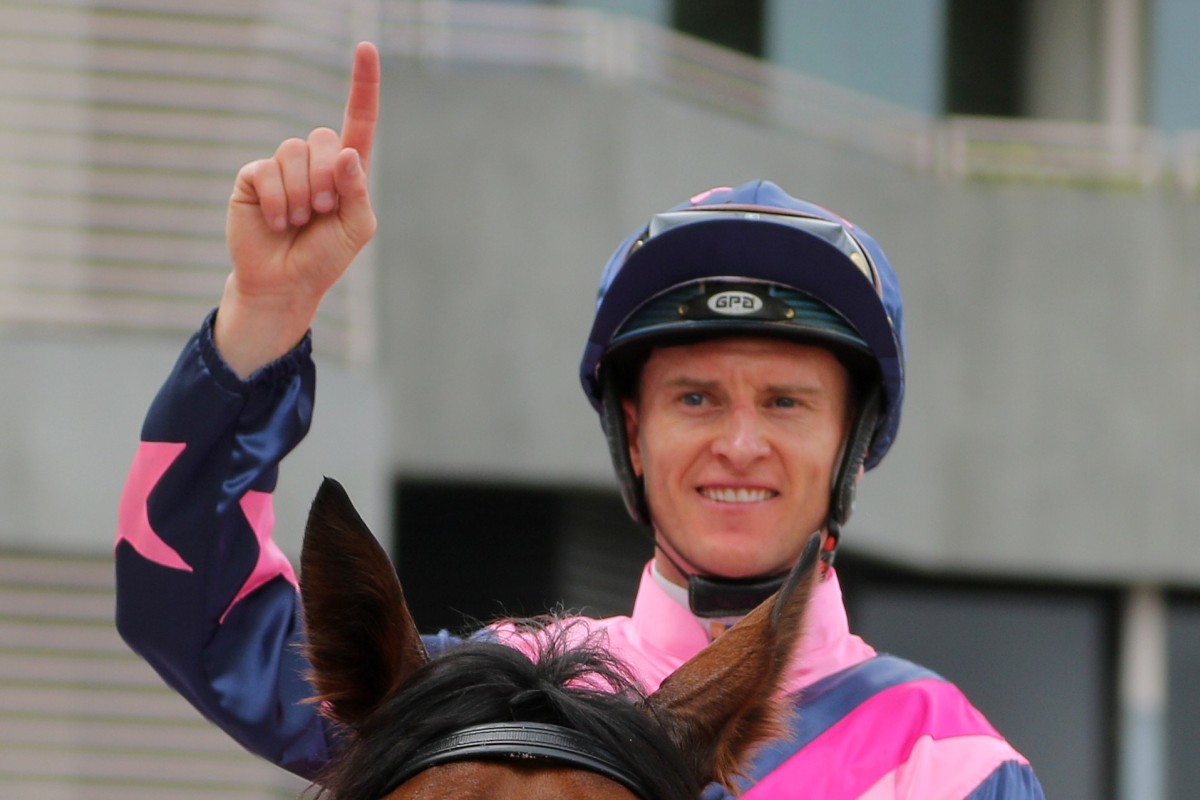 Zac Purton celebrates his 150th winner of the season. Photo: Kenneth Chan