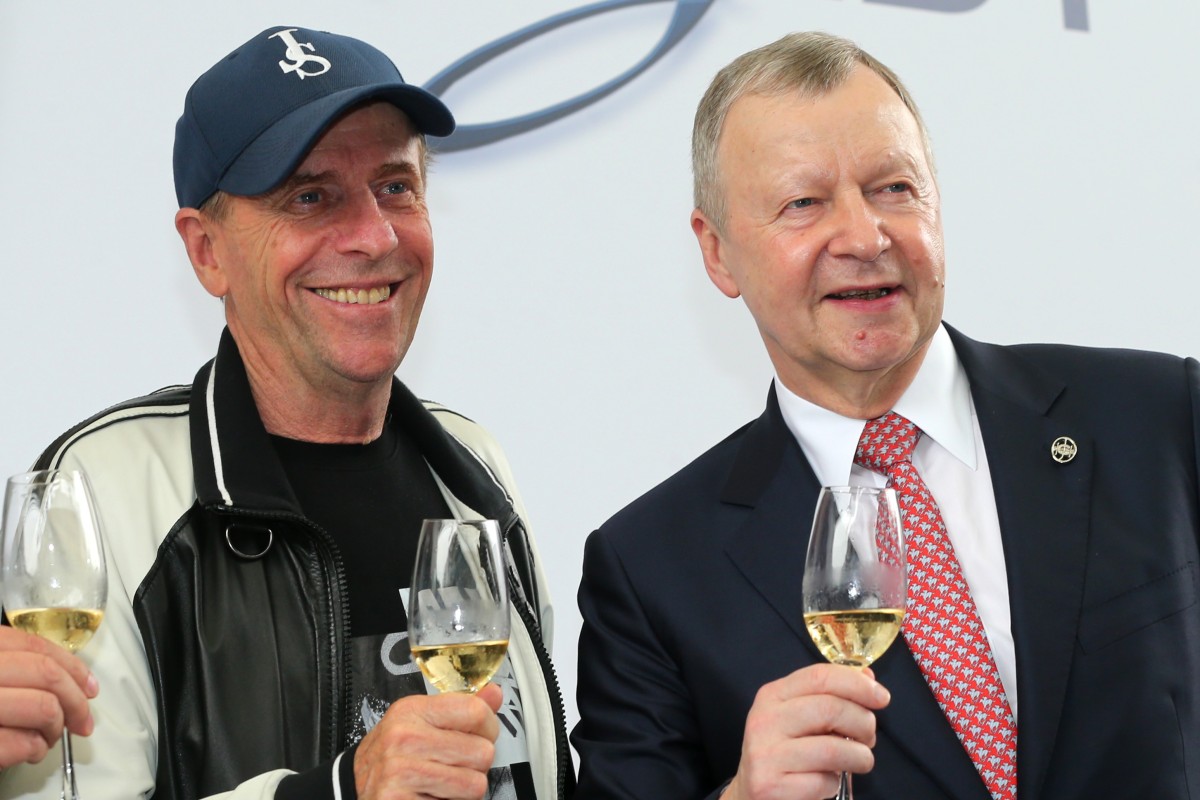 Jockey Club chief executive Winfried Engelbrecht-Bresges shares a drink with trainer John Size. Photos: Kenneth Chan