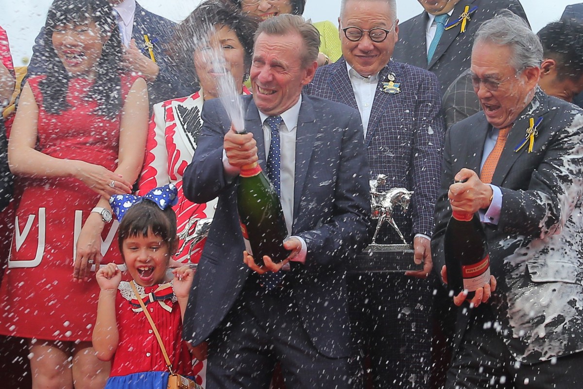 John Size (middle) celebrates his 11th trainers’ premiership at Sha Tin on Sunday. Photos: Kenneth Chan