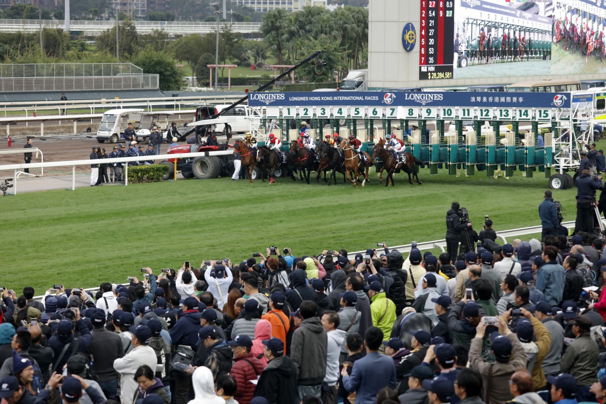 The crowd cheers as horses take off to race in Hong Kong. Photos: Kenneth Chan