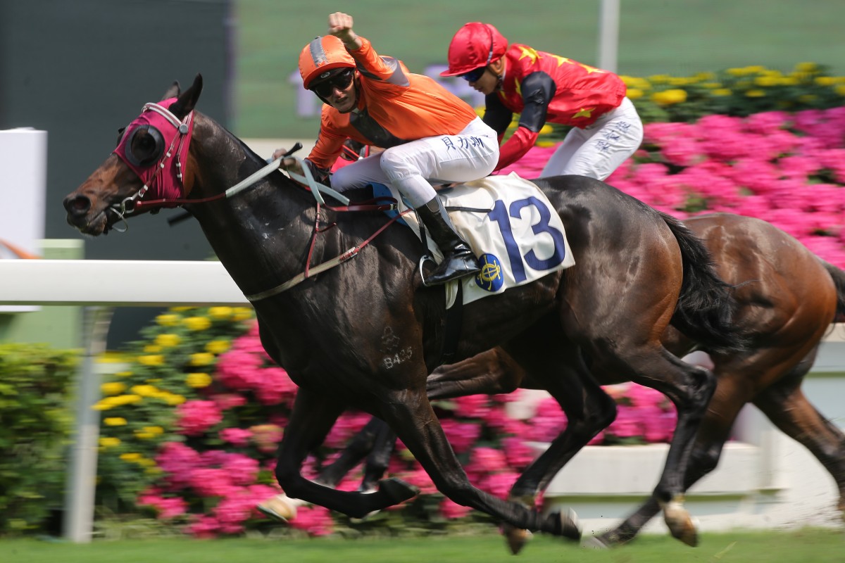 Regan Bayliss salutes after guiding Champion Supreme to victory at Sha Tin in April. Photos: Kenneth Chan
