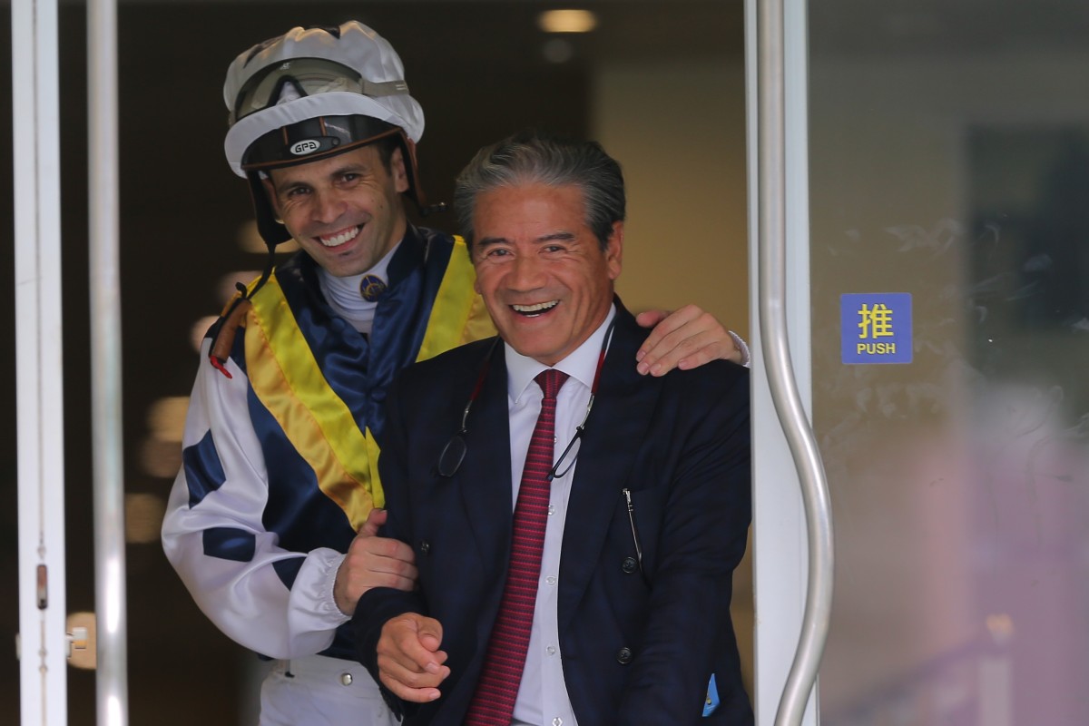 Jockey Aldo Domeyer and trainer Tony Cruz celebrate their win in the stewards room after the run of Sunshine Warrior. Photos: Kenneth Chan