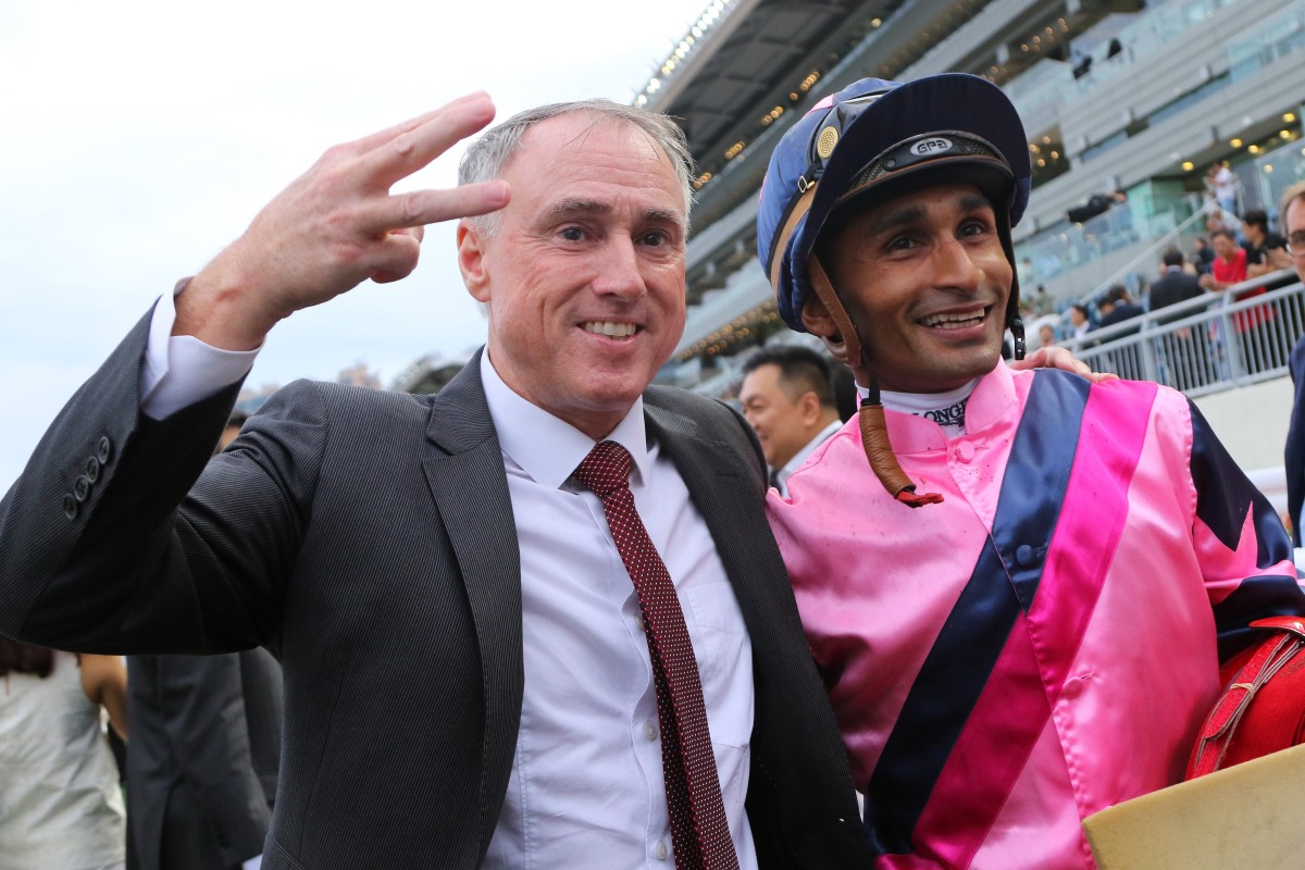 Trainer Paul O’Sullivan celebrates his treble with jockey Karis Teetan. Photos: Kenneth Chan