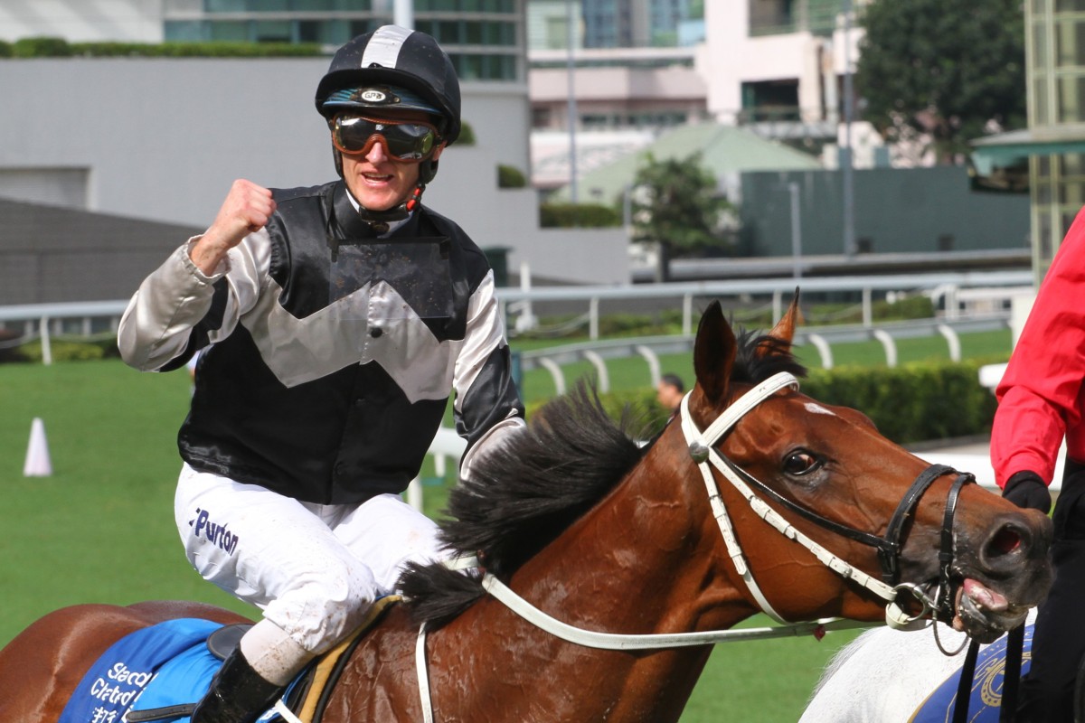 Zac Purton celebrates after piloting Exultant to Group One glory last season. Photos: Kenneth Chan