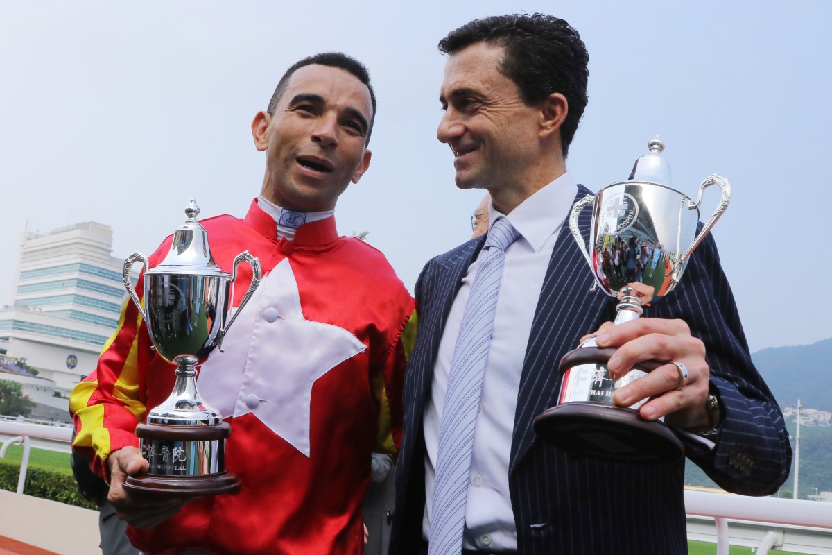 Jockey Joao Moreira and trainer Douglas Whyte celebrate Relentless Me’s victory. Photos: Kenneth Chan