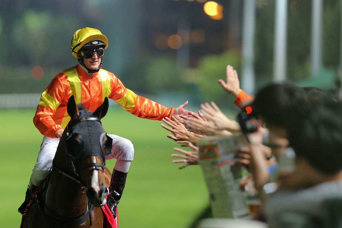 Zac Purton celebrates a winner with fans at Happy Valley earlier this month. Photos: Kenneth Chan