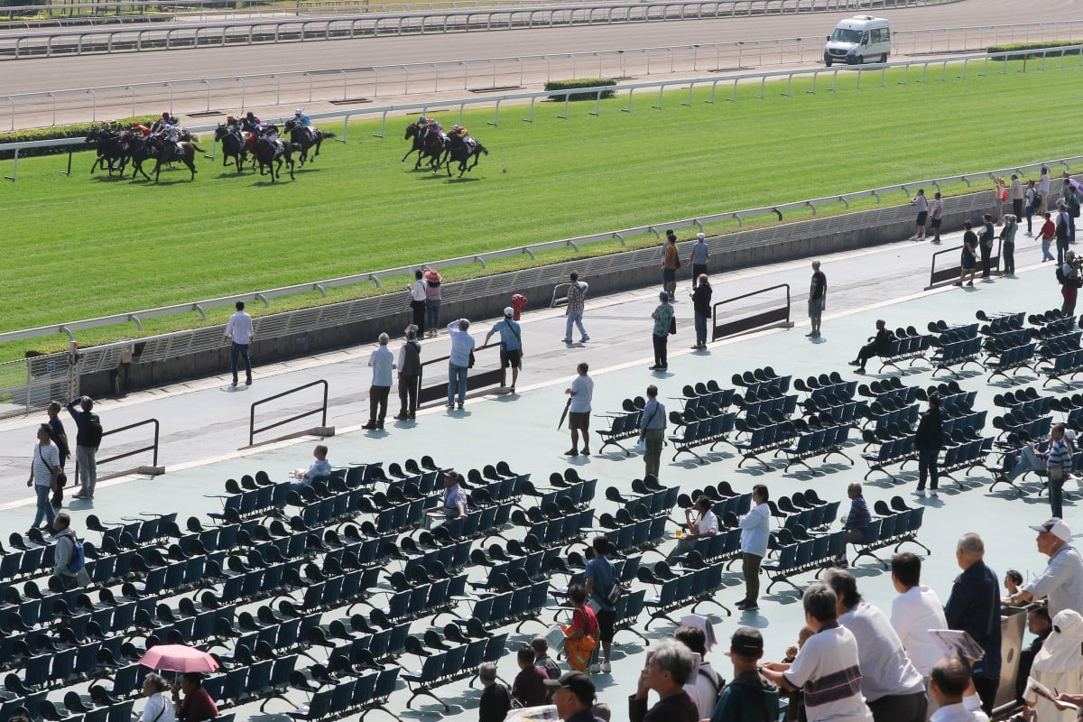 Horses race in front of a tiny crowd at Sha Tin on Sunday. Photos: Kenneth Chan