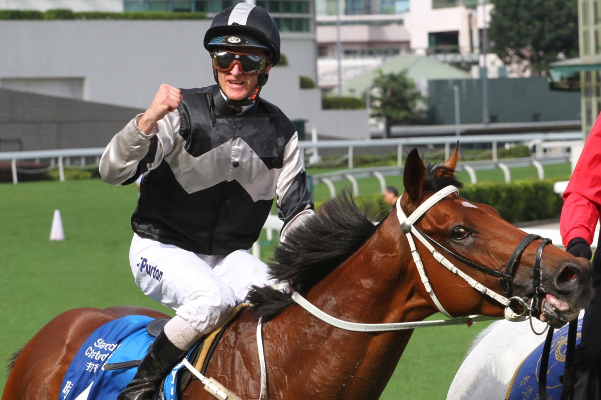 Zac Purton celebrates the win of Exultant last year. Photos: Kenneth Chan