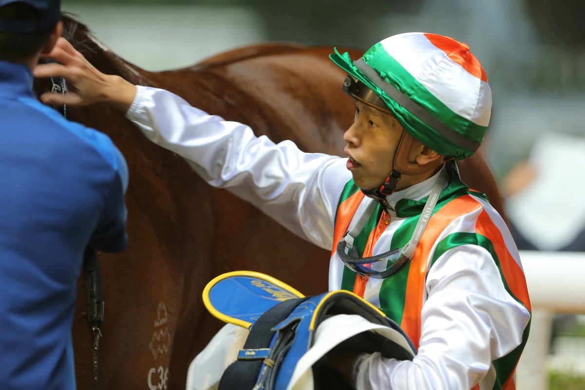 Vincent Ho dismounts from one of his winners. Photos: Kenneth Chan