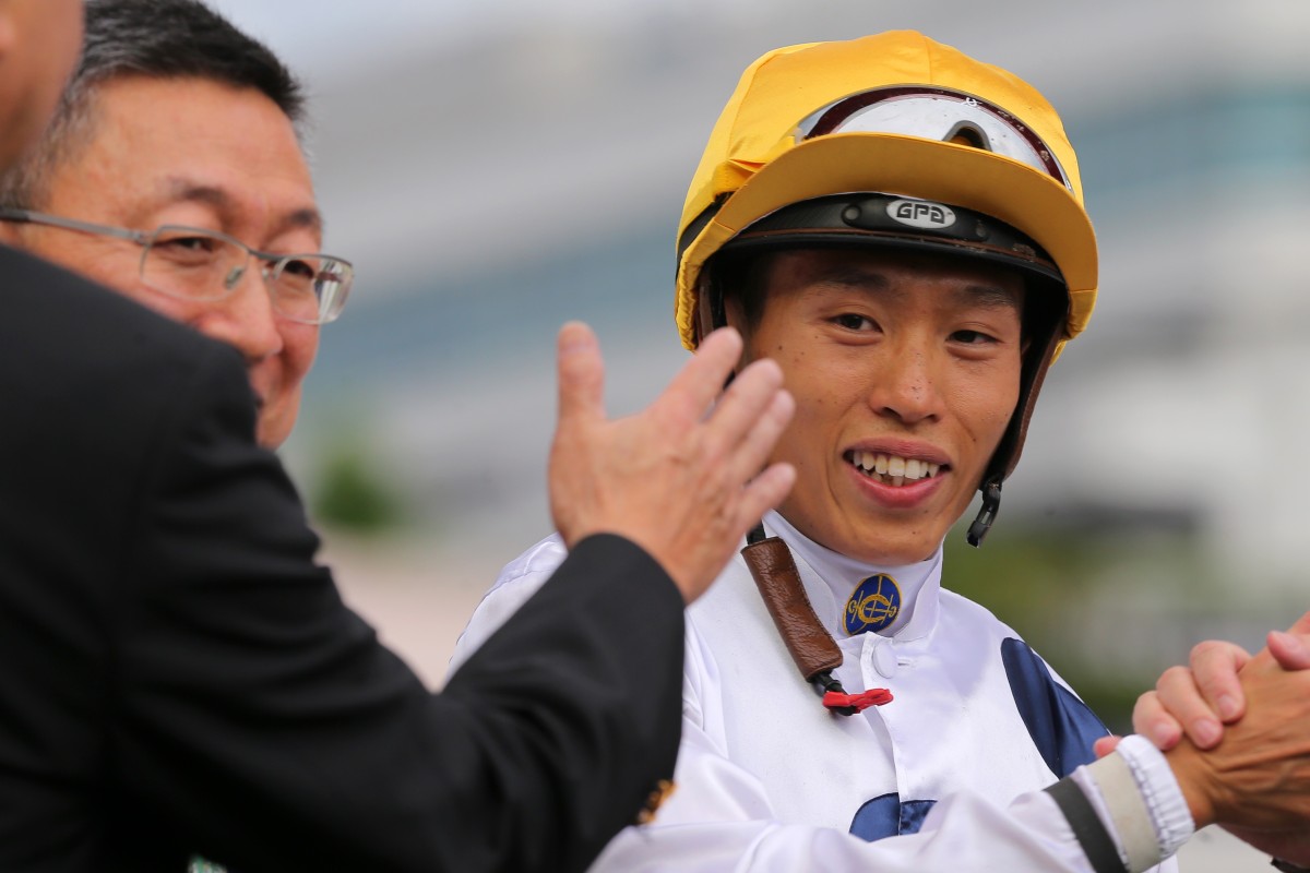 Vincent Ho celebrates a Golden Sixty win with trainer Francis Lui. Photos: Kenneth Chan