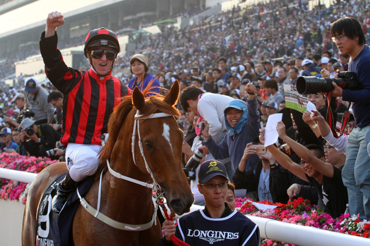 Zac Purton celebrates after winning the 2017 Hong Kong Cup with Time Warp. Photos: Kenneth Chan