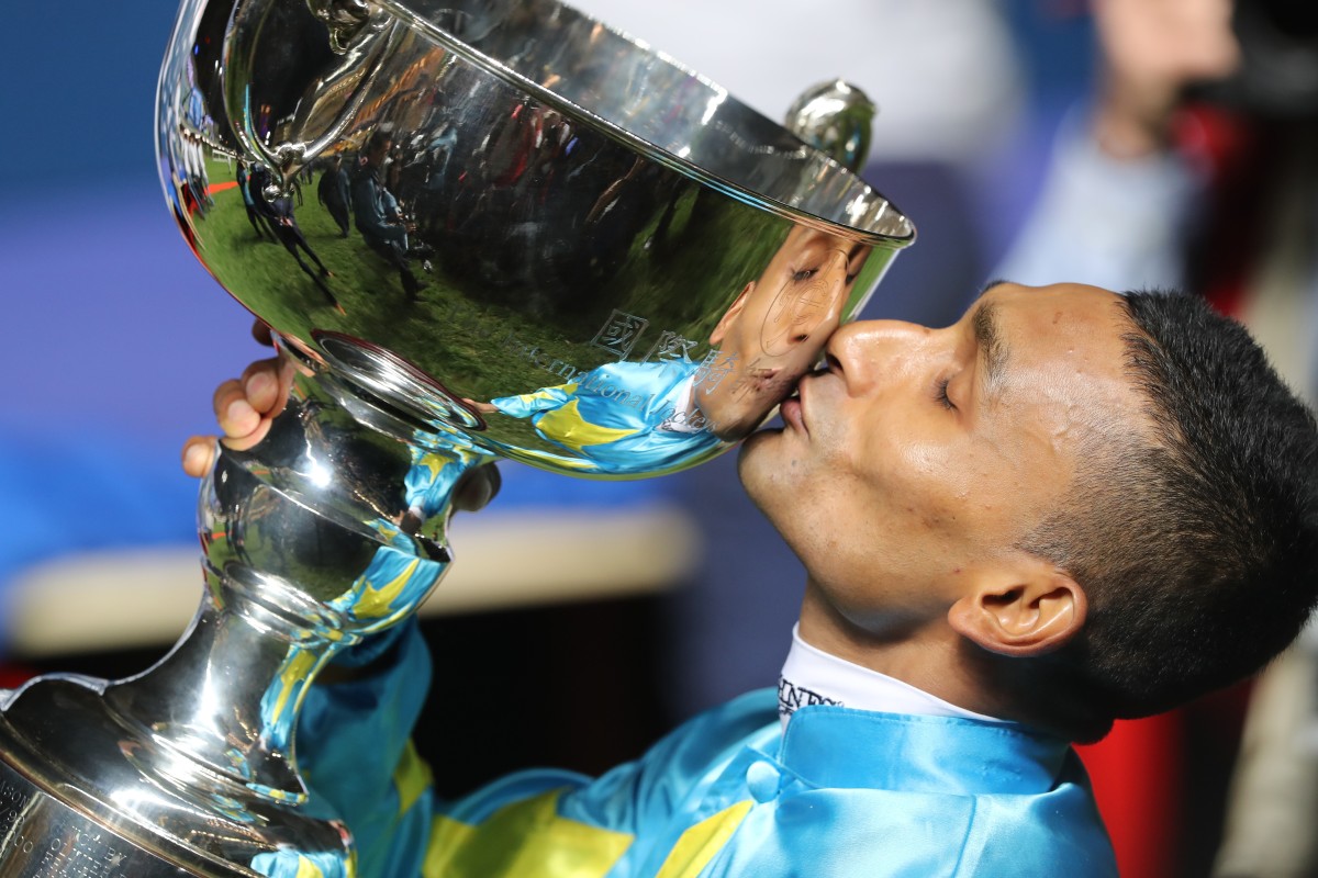 Karis Teetan kisses the Longines International Jockeys’ Championship trophy at Happy Valley on Wednesday night. Photo: Kenneth Chan