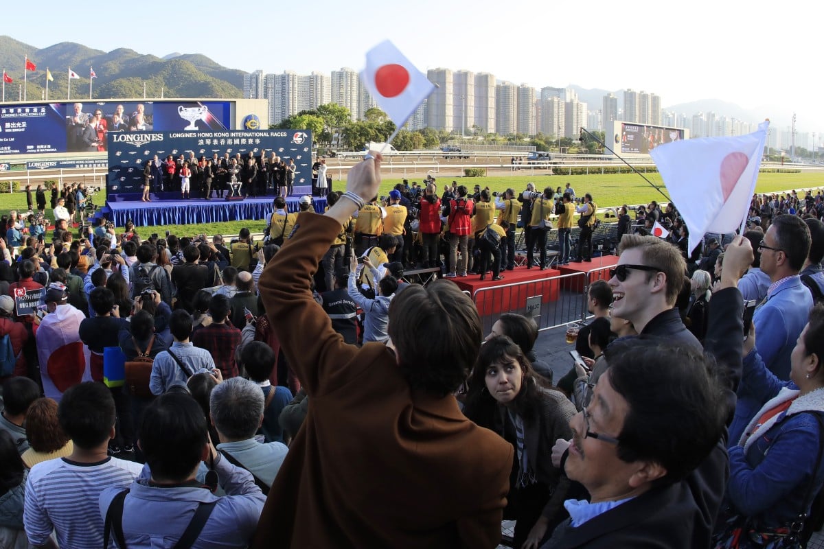 Racing fans wave Japanese flags after Win Bright’s victory in the Hong Kong Cup. Photos: Kenneth Chan