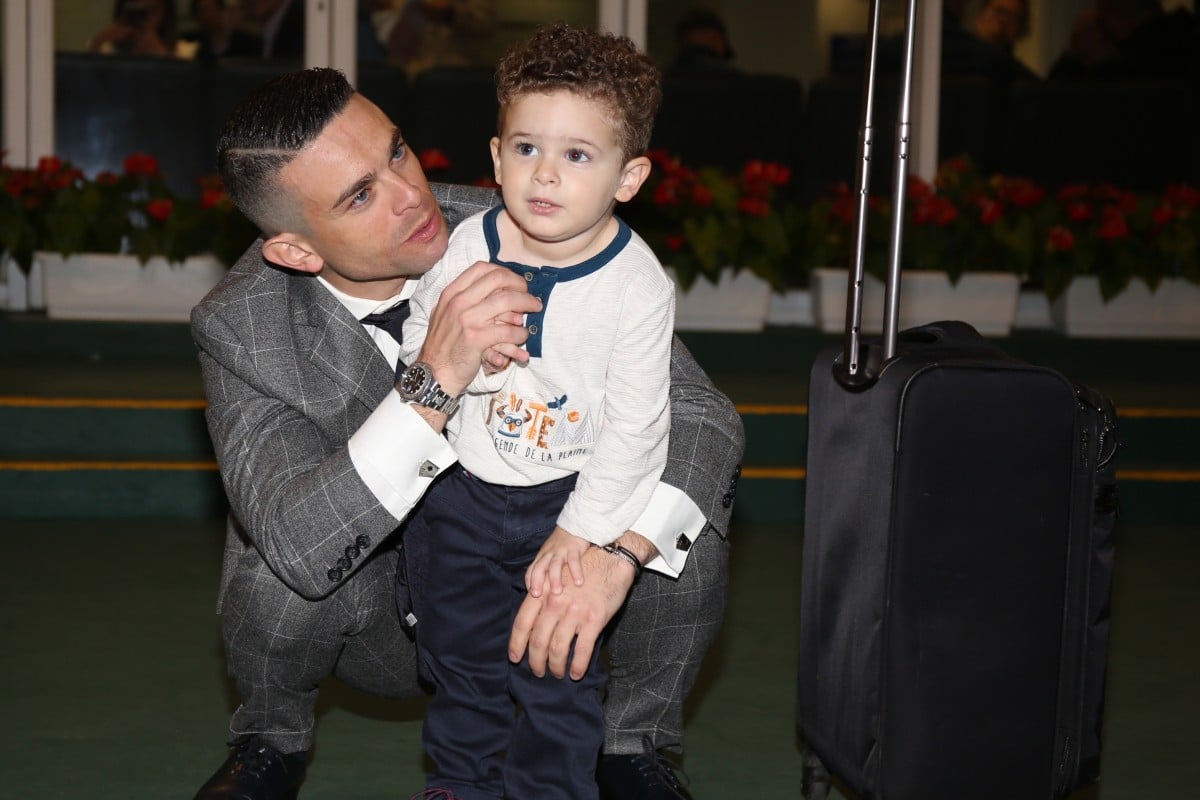 Umberto Rispoli with his son Hayden after his final ride in Hong Kong on Sunday. Photos: Kenneth Chan