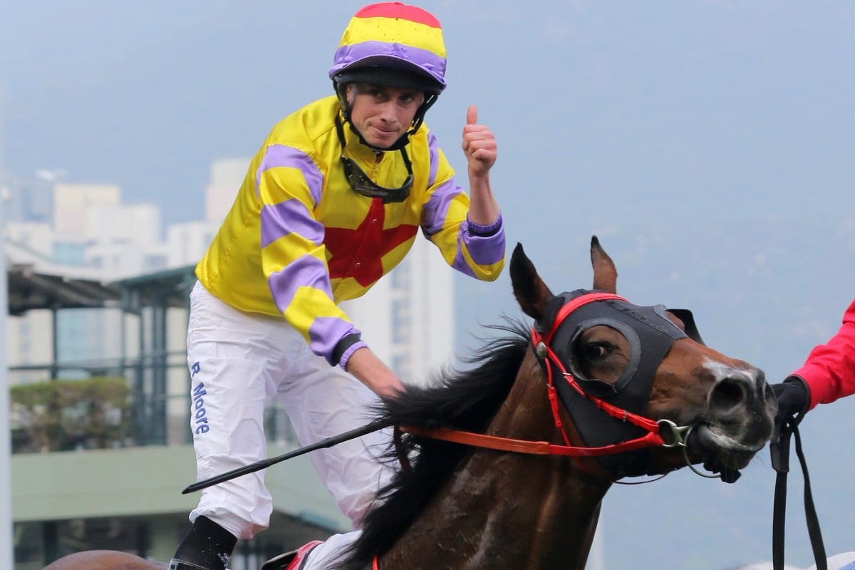 Ryan Moore gives a thumbs up after winning the Hong Kong Derby on Ping Hai Star in 2018. Photos: Kenneth Chan