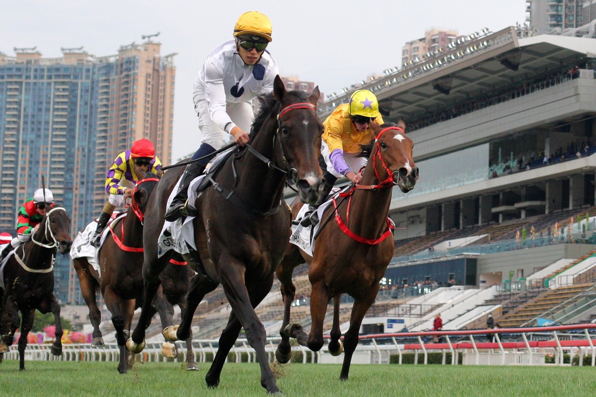 Golden Sixty surges home to win ahead of stablemate More Than This at Sha Tin on Monday. Photos: Kenneth Chan