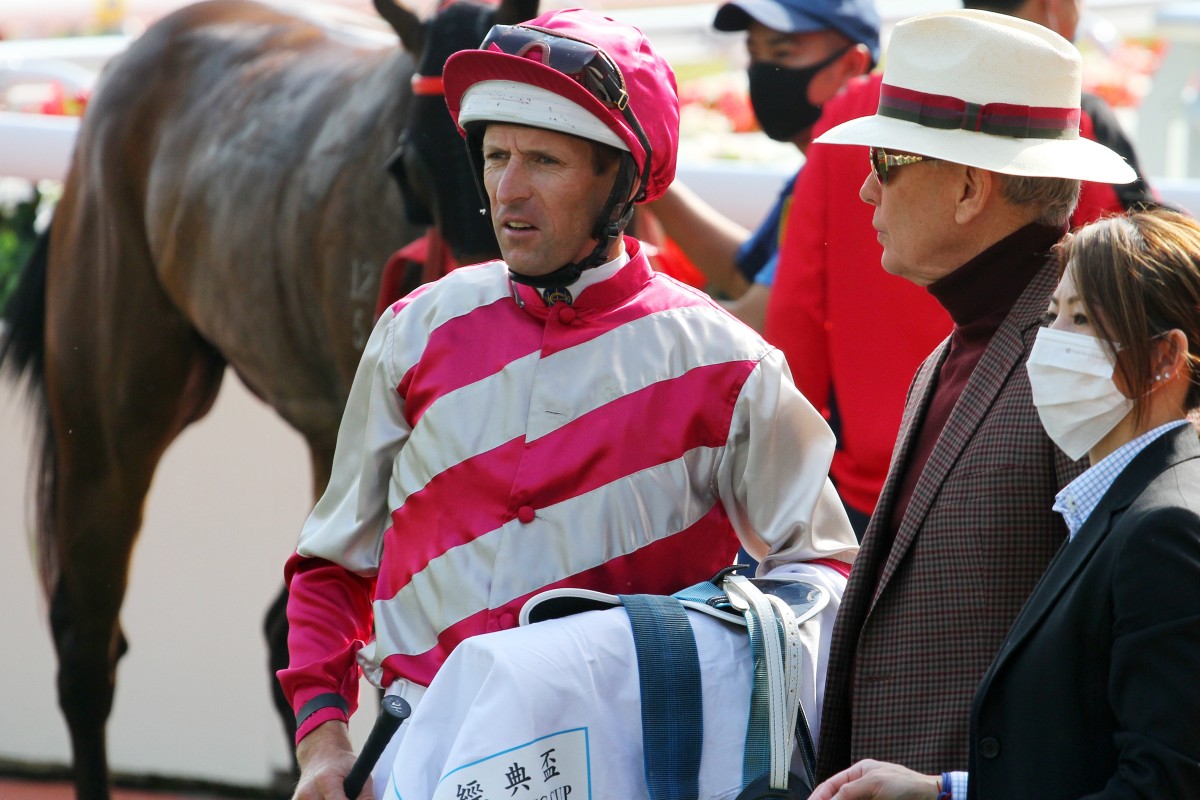 Hugh Bowman and John Moore talk after the run of Enjoying in the Classic Cup. Photos: Kenneth Chan