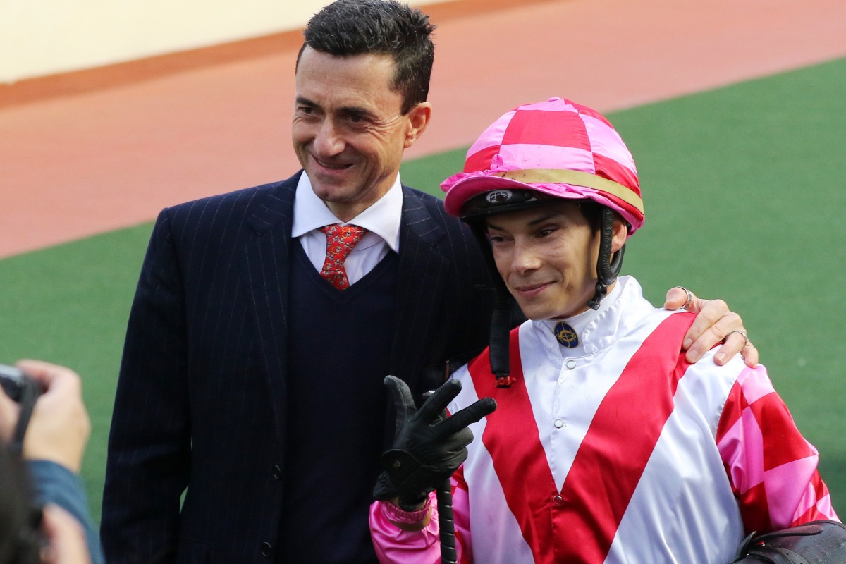 Trainer Douglas Whyte with jockey Alexis Badel at Sha Tin after a win from Super Wealthy.