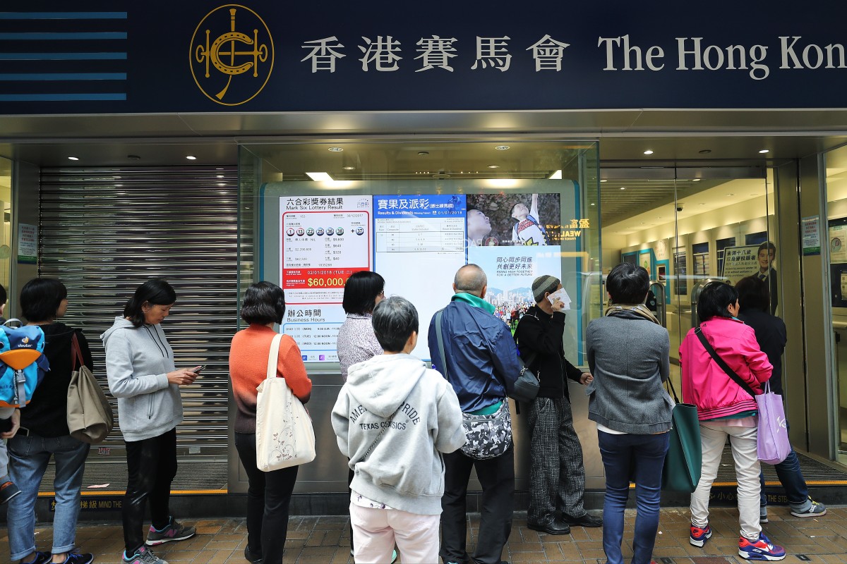 Punters line up at a Hong Kong Jockey Club off-course betting branch. Photo: SCMP / Winson Wong
