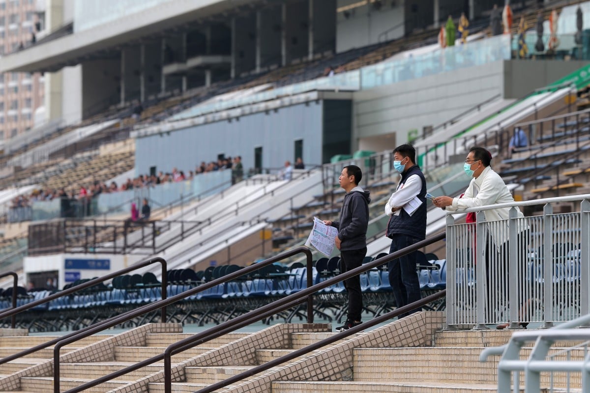 Three racing fans watch the races at Sha Tin in February. Photos: Kenneth Chan