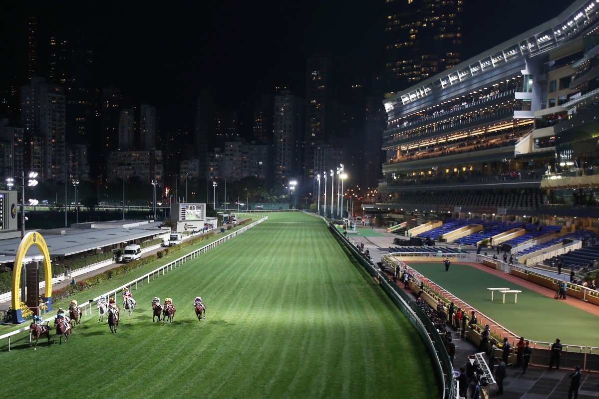 Horses cross the line at an empty Happy Valley. Photos: Kenneth Chan