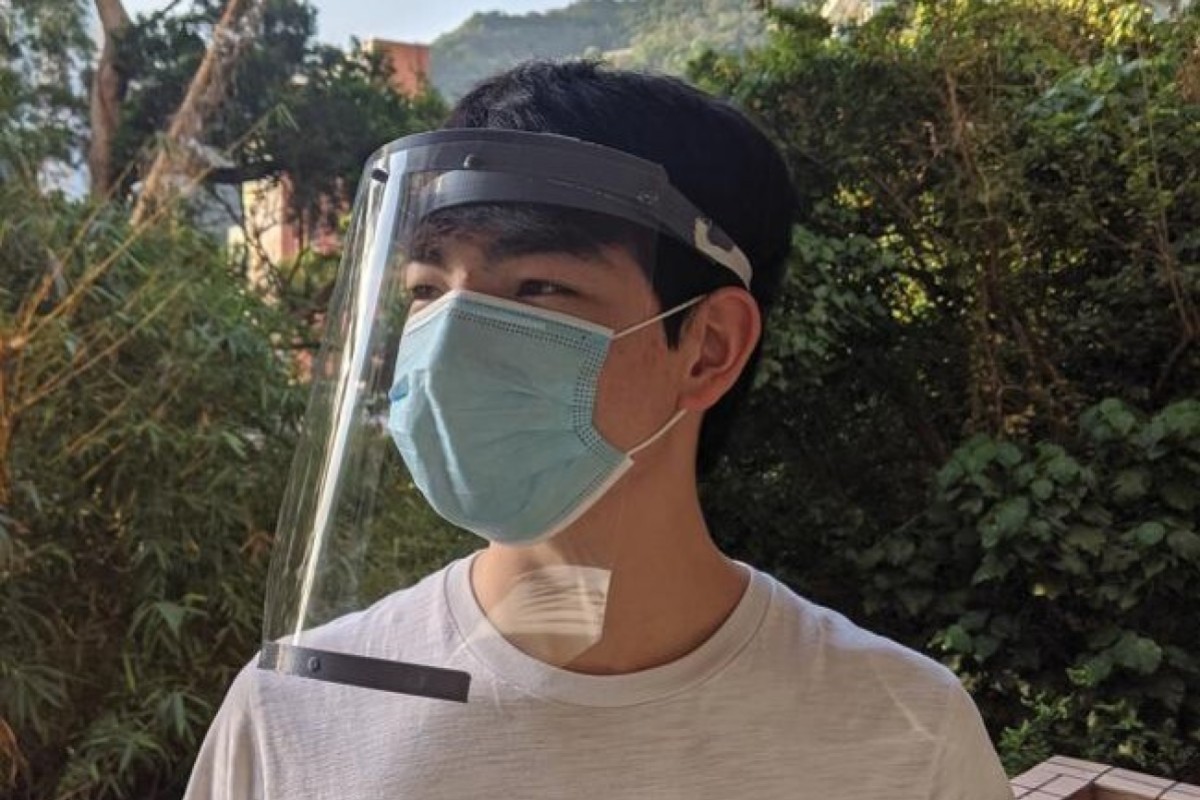 Dylan Fischer wears one of the face shields his group has 3D printed.