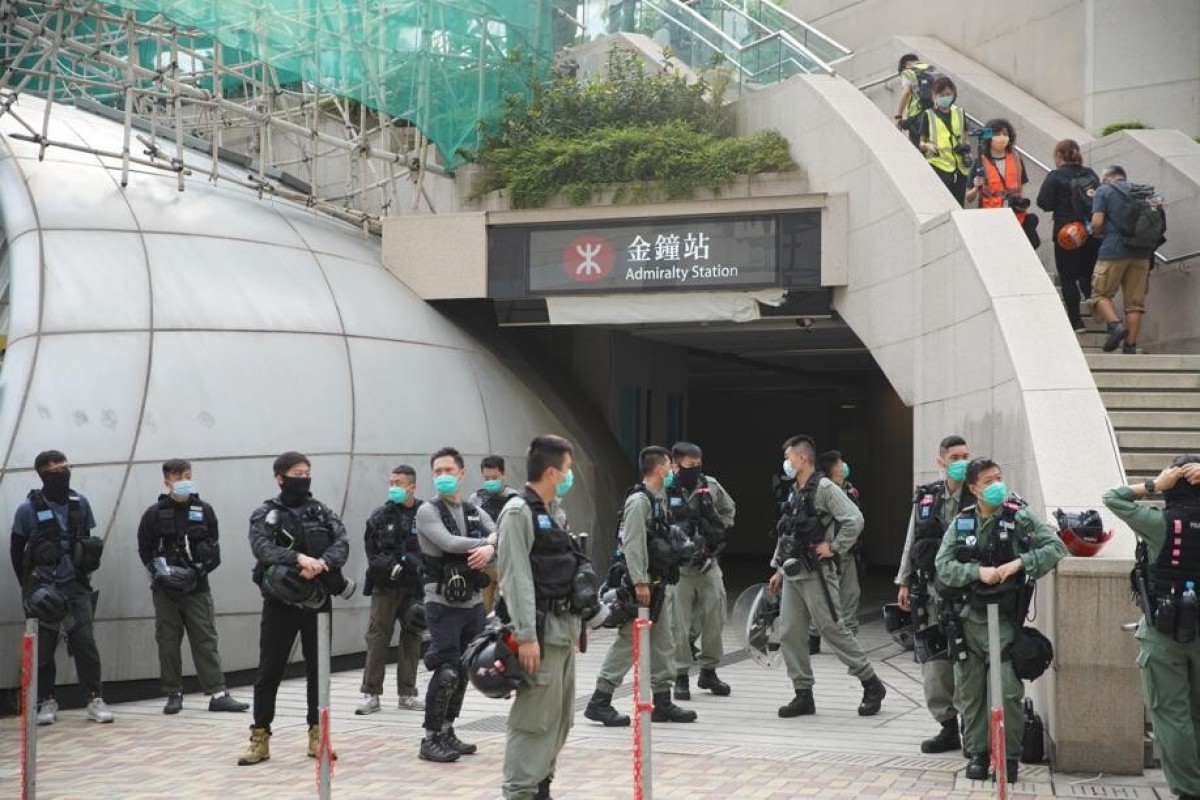 Police officers gather outside Admiralty MTR Station on Wednesday morning, as Legco pushed ahead to debate the proposed national anthem law.