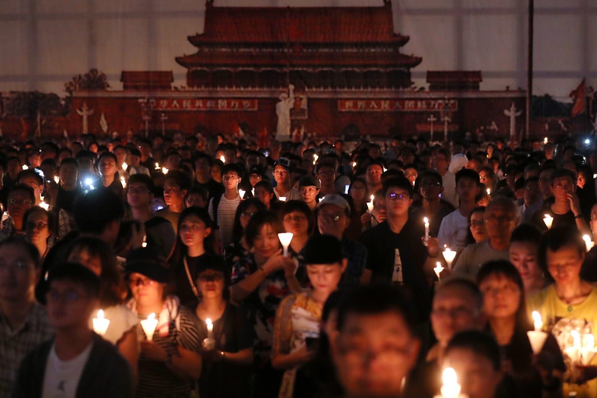 Crowds hold up their candles at the June 4th Candle Light Vigil, marking the 30th anniversary of the Tiananmen Square crackdown in 1989 in Victoria Park, Hong Kong.