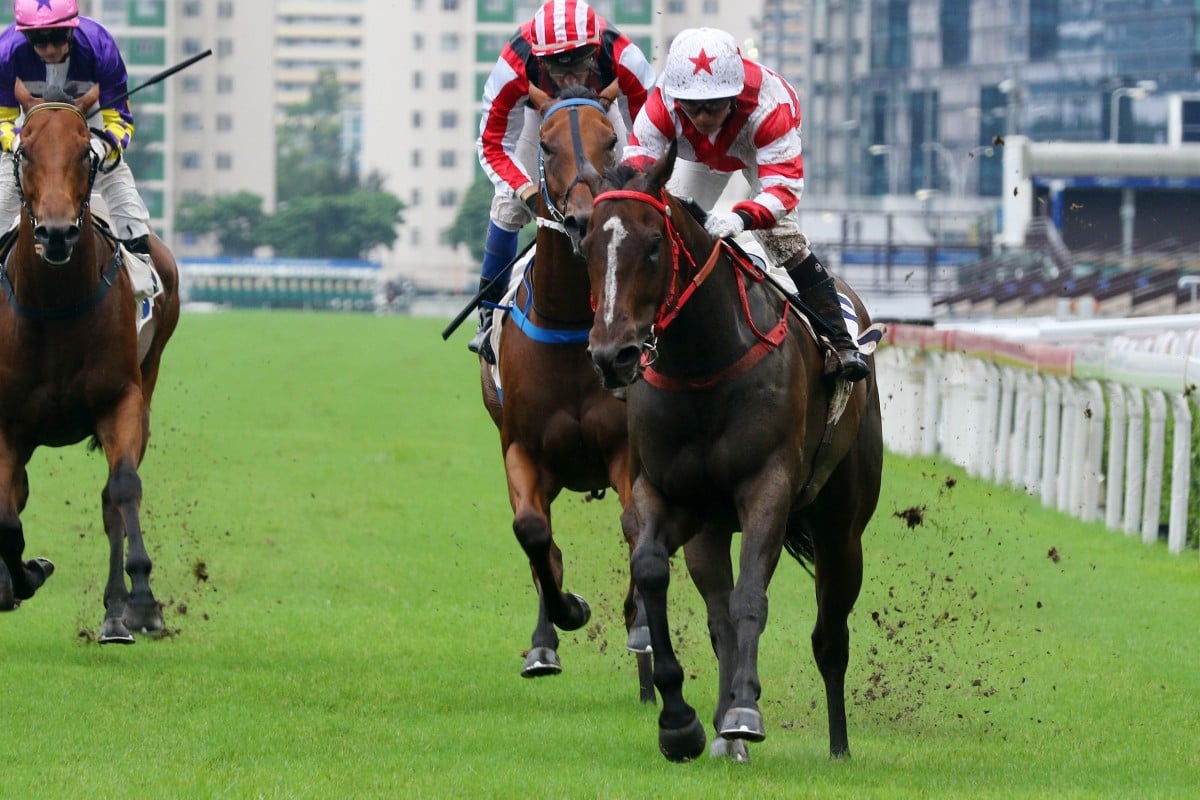 Baltic Whisper motors through the rain-soaked surface to win at Sha Tin on Sunday. Photos: Kenneth Chan