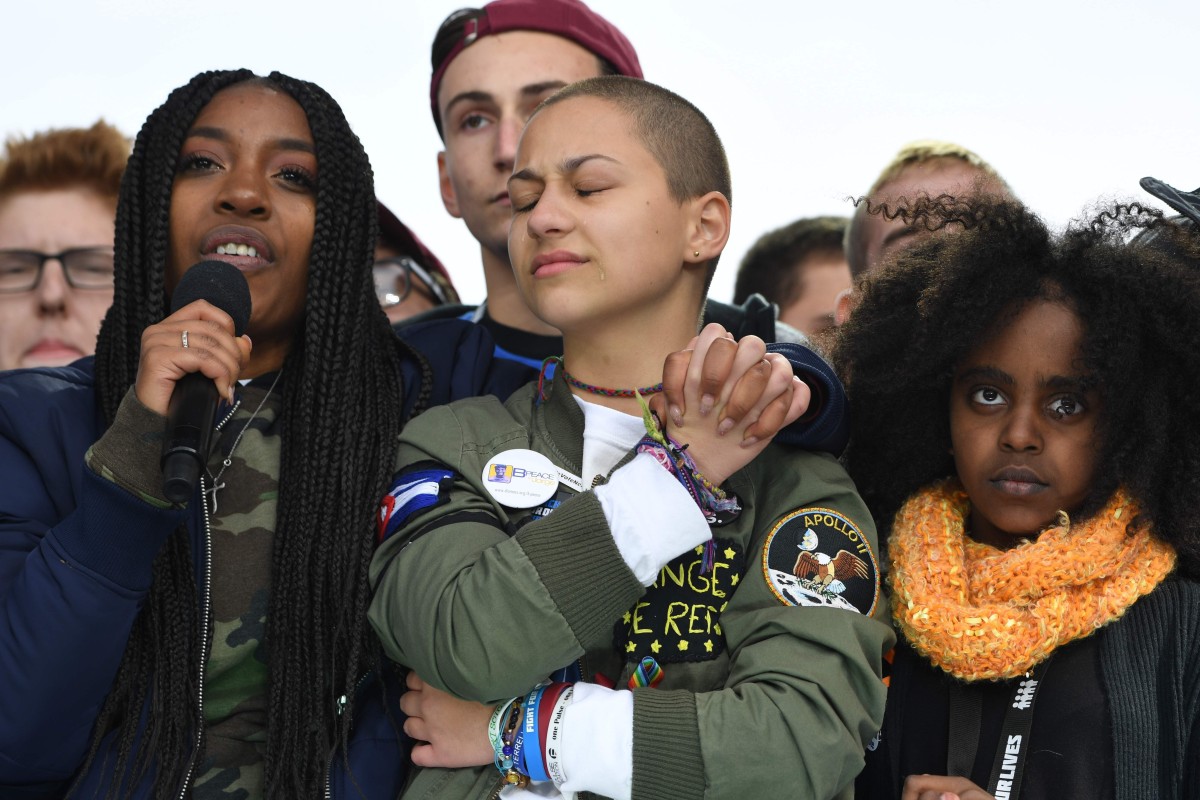 In this file photo taken on March 24, 2018, Marjory Stoneman Douglas High School student Emma Gonzalez listens with other students during the March for Our Lives Rally in Washington, DC. (Photo by JIM WATSON / AFP)