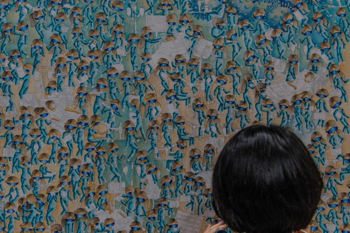 Wan Jamila Wan Shaiful Bahri, 17, paints in Shah Alam, on the outskirts of Kuala Lumpur. (Photo by Mohd RASFAN / AFP)