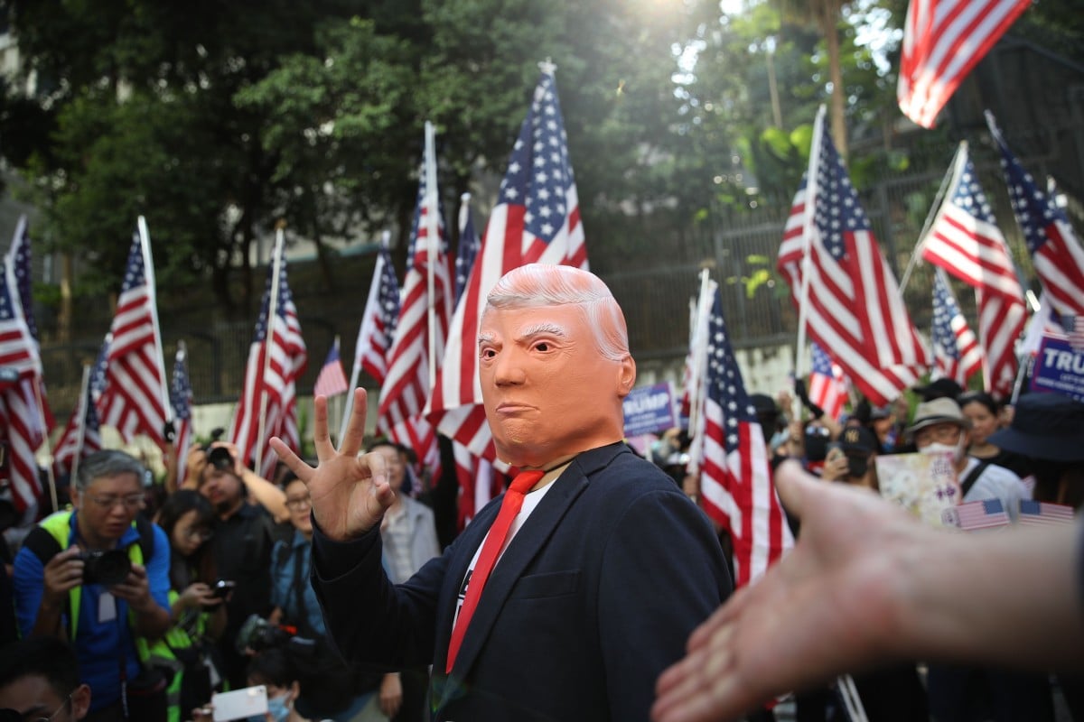 A Donald Trump impersonator stands with people gathering at Chater Garden for a “Thank You US” rally after President Trump signed the Hong Kong Human Rights and Democracy Act. Photo: SCMP/ Winson Wong