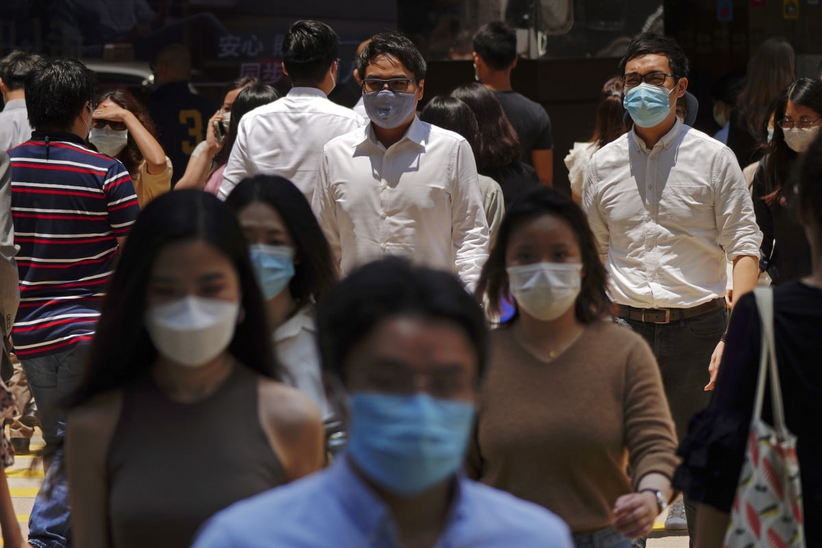 People cross the street during lunch time in Central. 19MAY20 SCMP / Sam Tsang