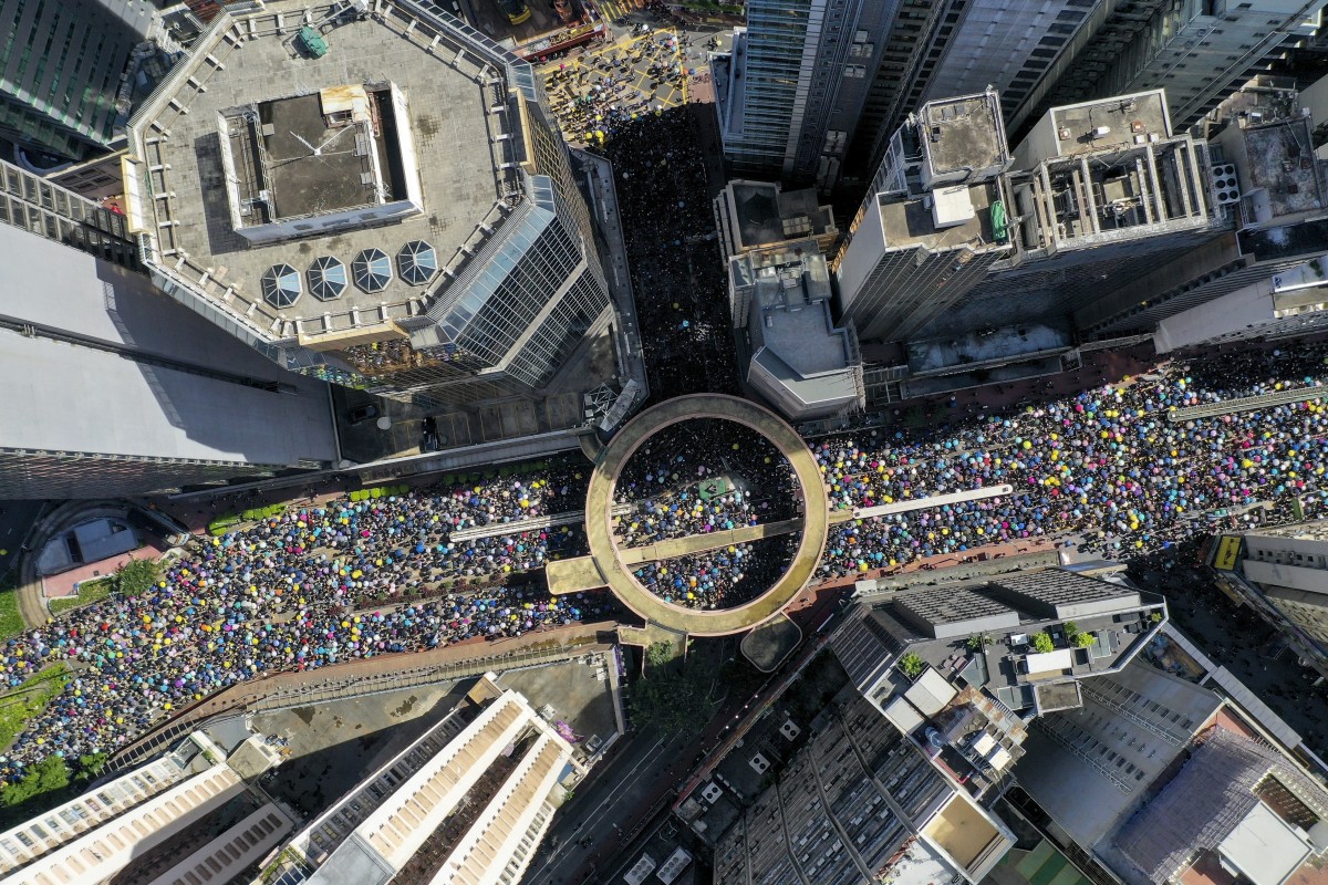 Protesters march from Victoria Park in Causeway Bay to the Central Government Offices in Tamar on July 1, 2019.