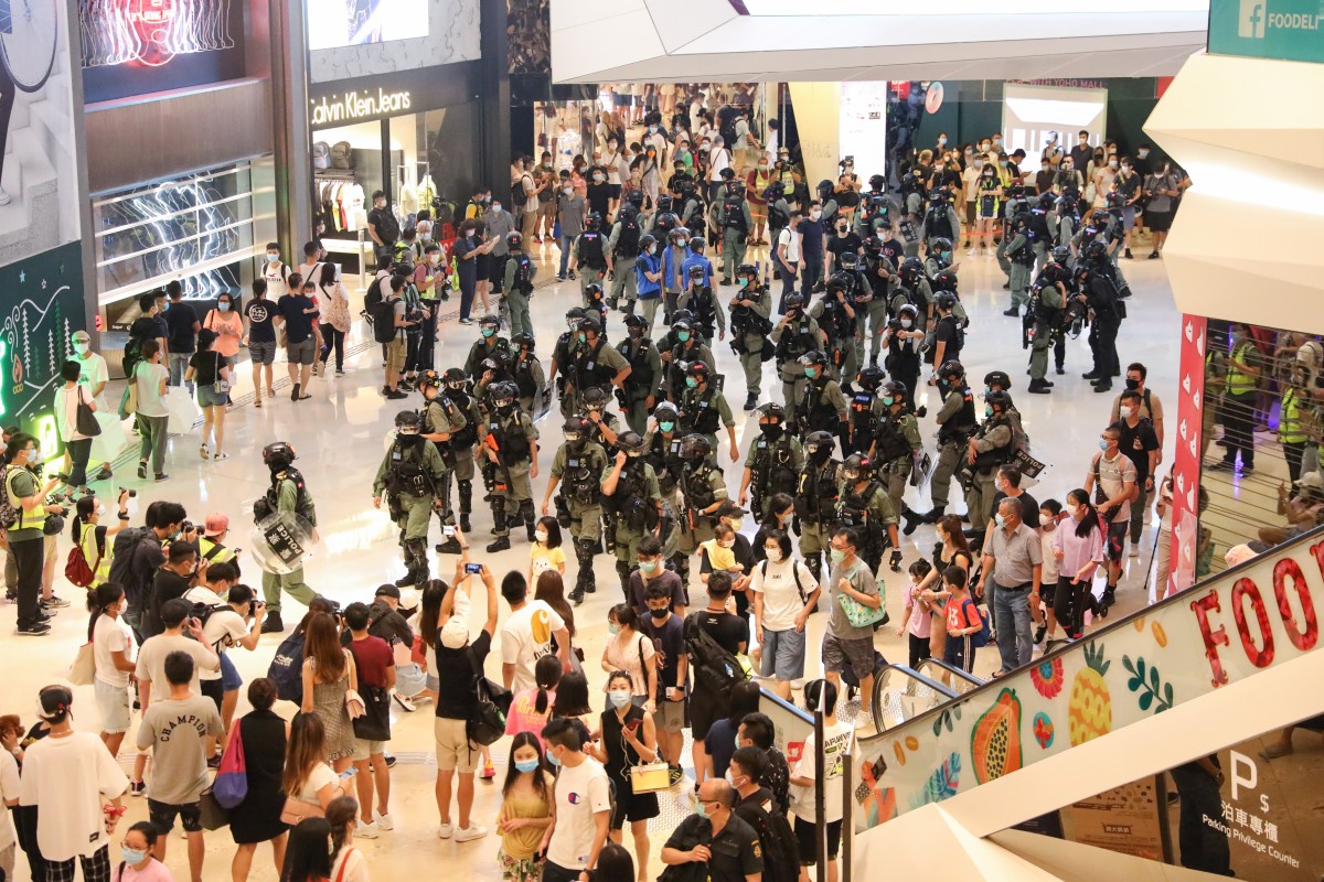 Police stand guard as anti-government protesters gather at Yoho mall in Yuen Long. Photo: SCMP / Dickson Lee