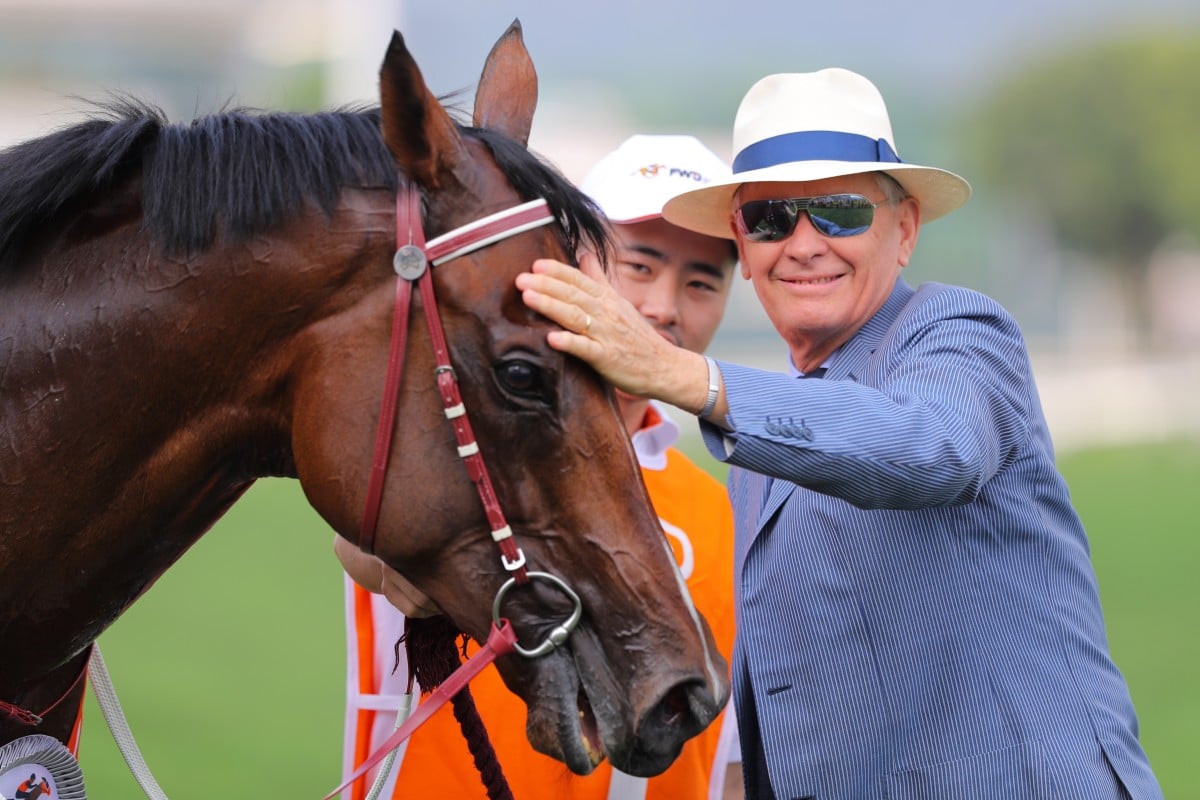 John Moore gives Beauty Generation a pat after his win in the 2019 Champions Mile. Photos: Kenneth Chan