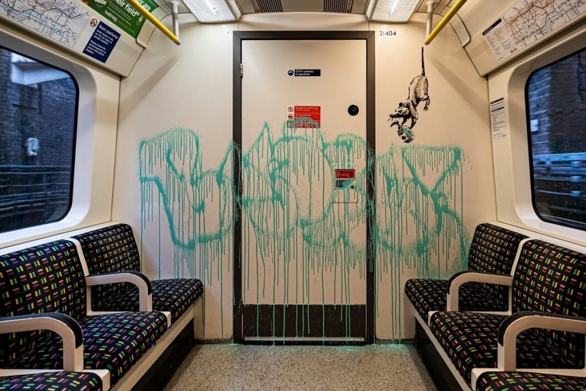 The artist signed his name before leaving the train carriage. Photo: Reuters
