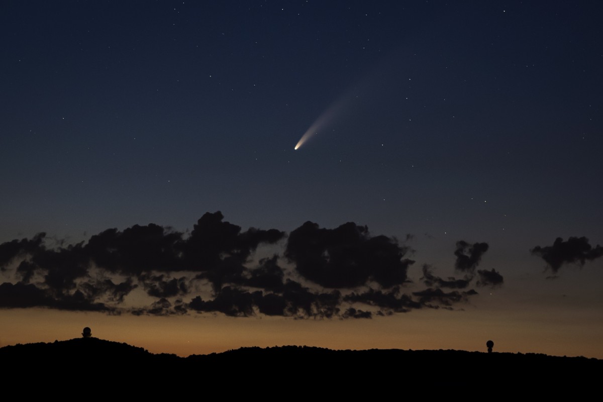 Neowise, or C/2020 F3, is seen above clouds over the Buschberg mountain in Puerstendorf, Austria, on 12 July. It passed closest to the sun on 03 July and its closest approach to Earth will occur on 23 July. Photo: EPA