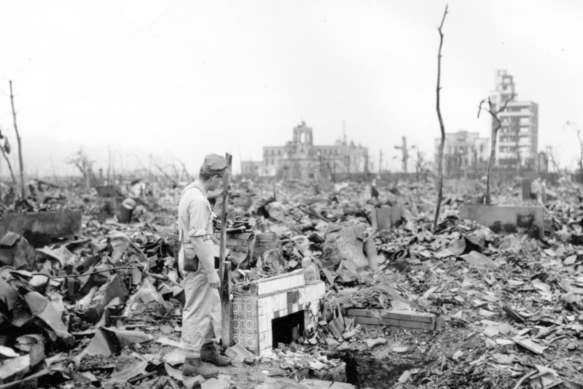 August 6 marks the 75th anniversary of the Hiroshima bombing. Almost everything within 2km of Ground Zero was destroyed. Photo: AP FILE - In this Sept. 7, 1945, file photo, an unidentified man stands next to a tiled fireplace where a house once stood in Hiroshima, western Japan. The Aug. 6, 1945, bombing was the world’s first nuclear attack. An estimated 140,000 people, including those with radiation-related injuries and illnesses, died through Dec. 31, 1945. That was 40% of Hiroshima’s population of 350,000 before the attack. (AP Photo/Stanley Troutman, Pool, File)