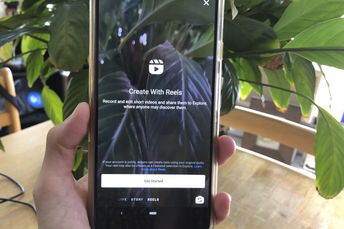 Instagram Reels is displayed on a mobile phone on Wednesday, Aug. 5, 2020 in New York. Facebook's Instagram is officially launching its answer to the hit short video app TikTok — Instagram Reels. The new Instagram feature will let users record and edit 15-second videos with audio, and will let users add visual effects. Users will be able to share Reels with followers in Instagram in a dedicated section called Reels in Explore, or in the Story feature where posts disappear after 24 hours. (AP Photo/Tali Arbel)