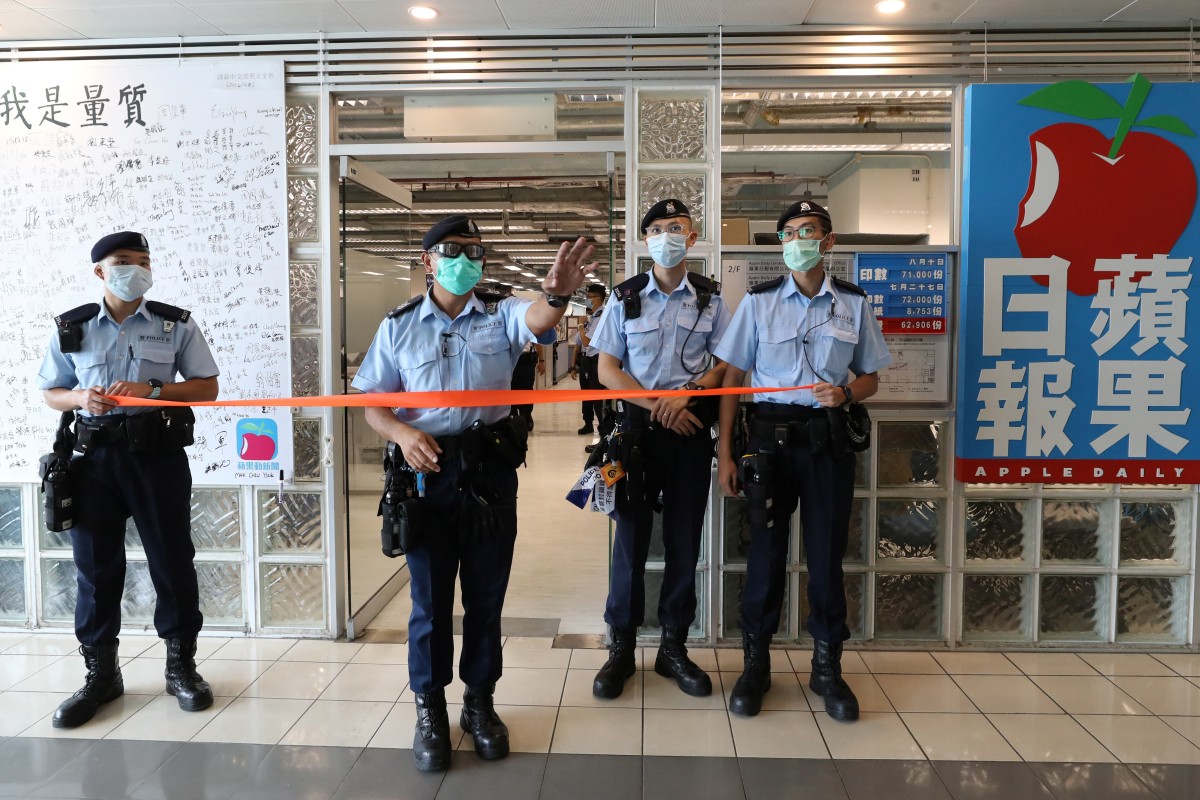 Hong Kong police officers raided the offices of Apple Daily on August 10.