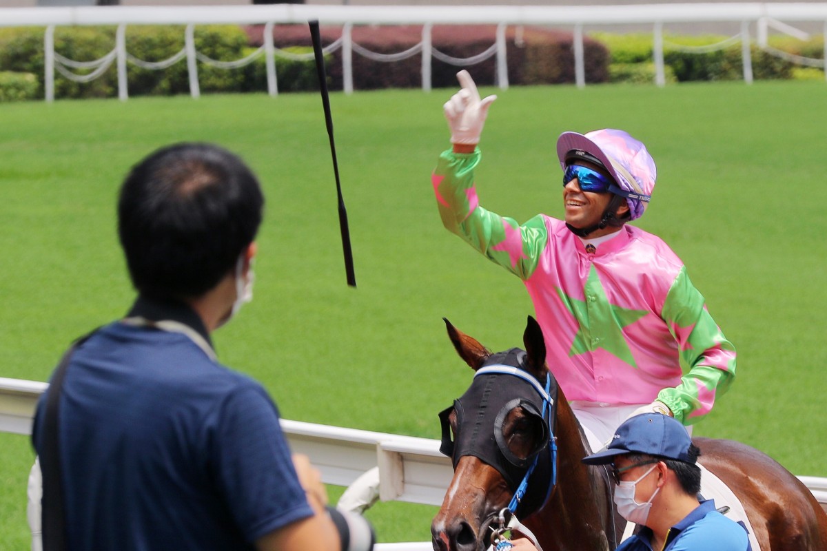 Jockey Joao Moreira throws his whip after a win at Sha Tin. Photos: Kenneth Chan