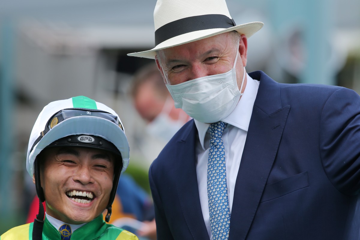 Jockey Keith Yeung and trainer David Hayes celebrate Moneymore’s win at Sha Tin on Sunday. Photos: Kenneth Chan