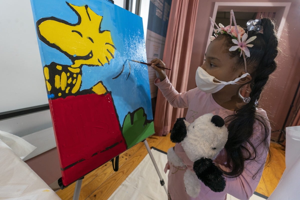 Kaley Williams, 8, paints a panel of a "Peanuts" mural that will be placed in the outpatient pediatric floor of One Brooklyn Health at Brookdale Hospital. Photo: AP