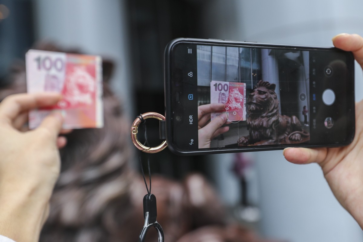 You might not think about how dirty money or your phone are, but they can harbour the coronavirus for weeks. Photo: SCMP/ Winson Wong