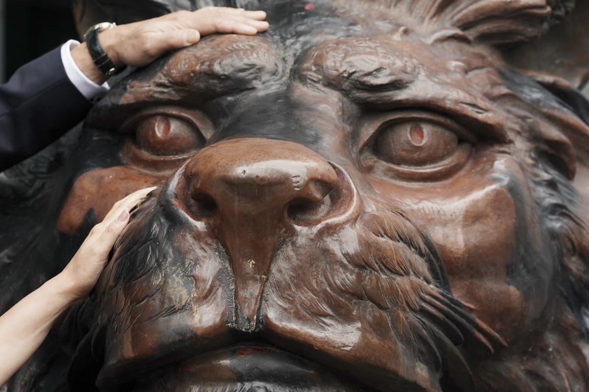 HSBC’s iconic lion sculptures are back home. Photo: SCMP / Felix Wong