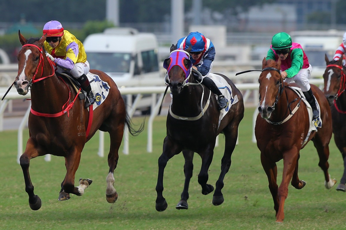 Jockey Alexis Badel and Ping Hai Bravo (left) storm past Flying Genius (middle) and Joyful Fortune (right). Photo: Kenneth Chan