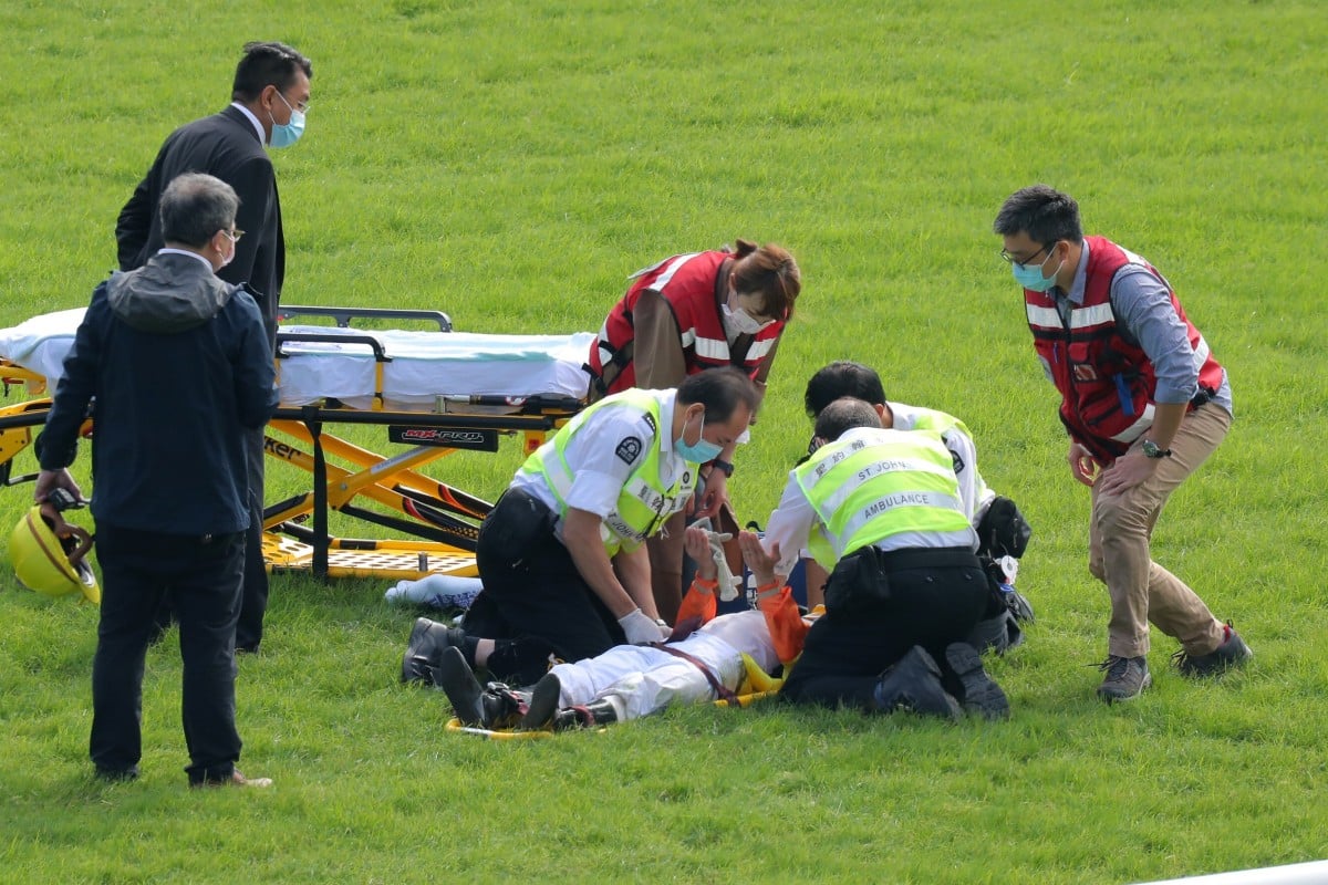 Matthew Chadwick in the hands of paramedics after a fall at Sha Tin on Sunday. Photos: Kenneth Chan