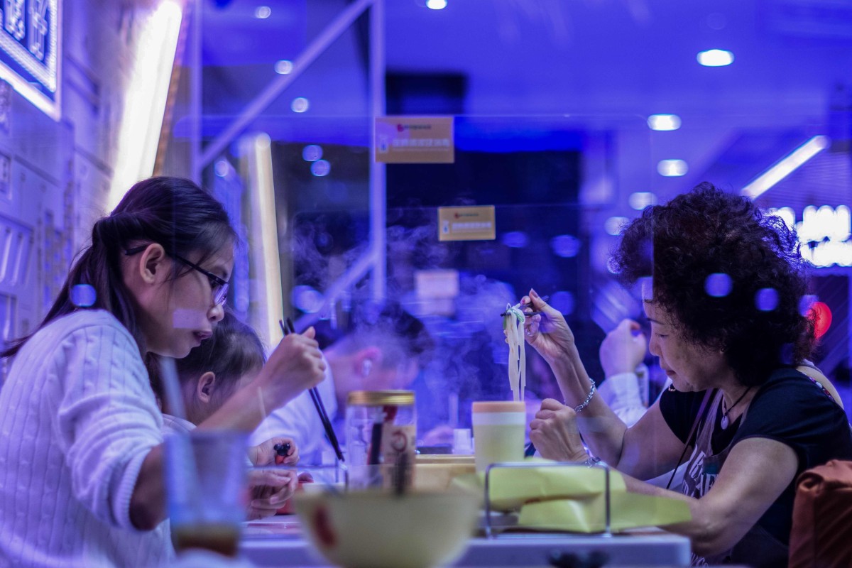 Back to two ... Today’s announcement will see diner numbers halved at restaurant tables. Photo: AFP)